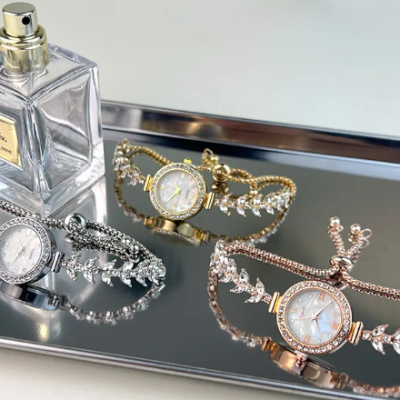 Affordable luxury diamond-embedded women’s quartz bracelet watch with adjustable strap and elegant minimalist dial