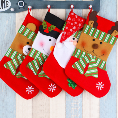 “Large Christmas gift bags and festive stockings with holiday designs for gifts, decorations, and party use.”