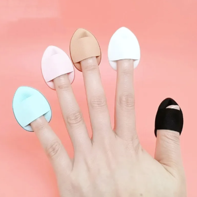 Beauty blender sponge showing flawless makeup application on skin with finger cover design