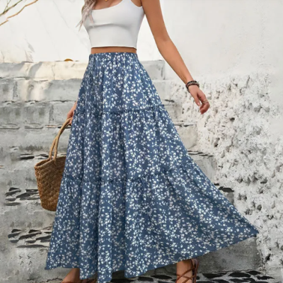 Woman wearing elegant high-waist spring and summer skirt with lightweight flowy A-line design for fresh seasonal fashion look