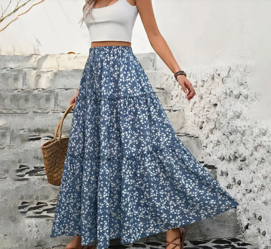Woman wearing elegant high-waist spring and summer skirt with lightweight flowy A-line design for fresh seasonal fashion look