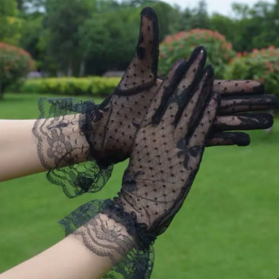 Elegant short wedding lace gloves with decorative bow for bridal and formal fashion